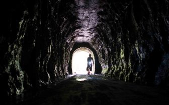 Riding through a tunnel on the Elroy-Sparta State Trail
