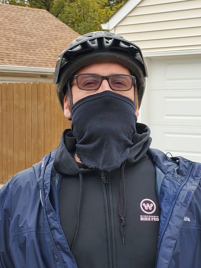 cyclist wears no sew mask before a ride