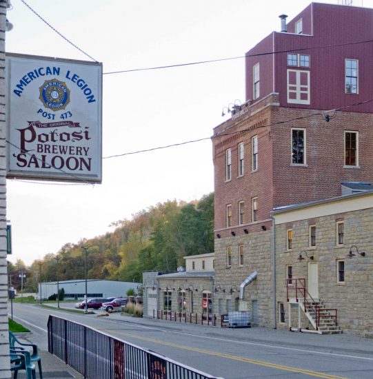 Potosi Saloon beer sign hangs across the street from the Potosi Brewery