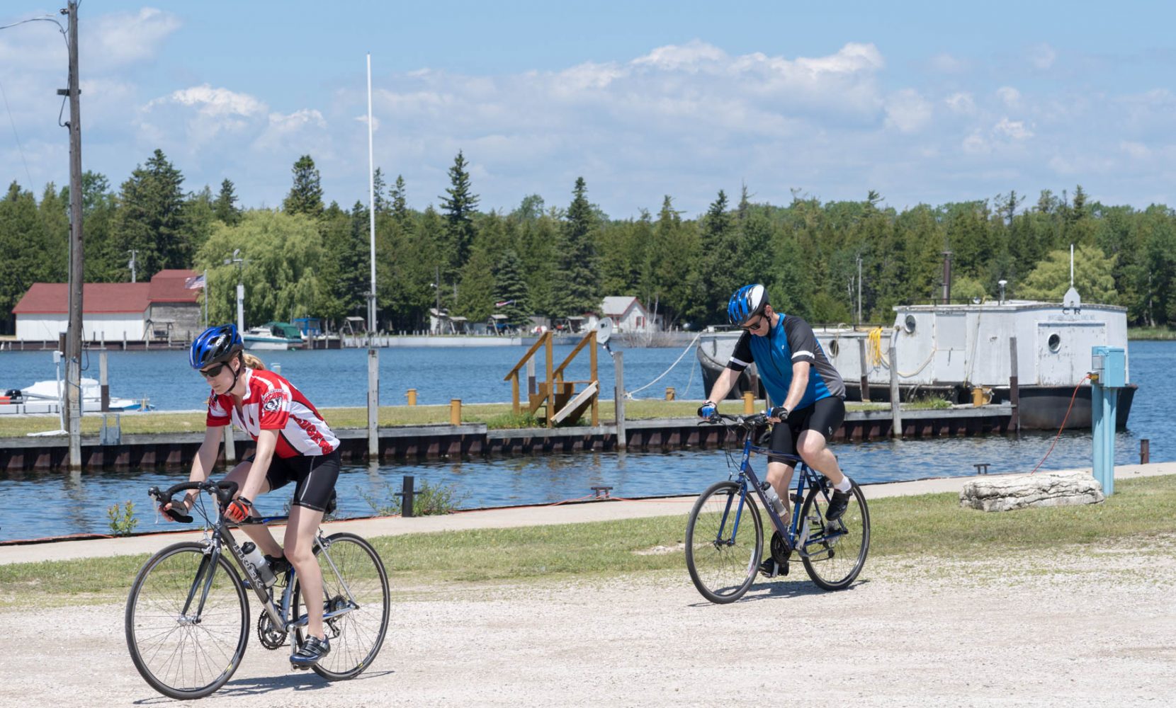 Two cyclists ride at Jackson Harbor on Washington Island.