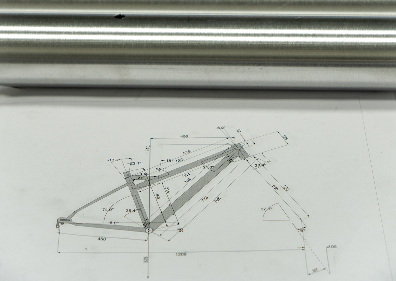 tubing over a CAD drawing of a frame