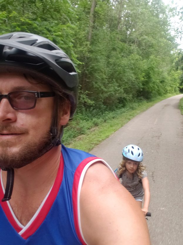 selfie riding with kid behind