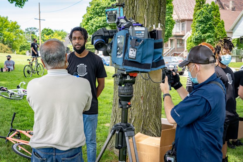 Sam (WebsterX) Ahmed is interviewed by news media before the Black is Beautiful Ride he helped organize
