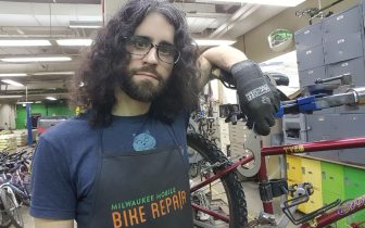 person in bike repair shop