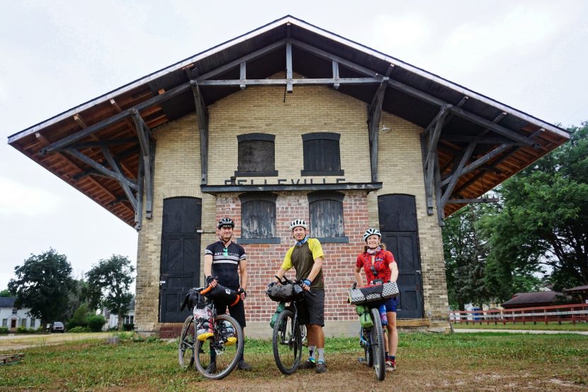 Art Brown II, Scott Haraldson and Laura Haraldson stand in front of the historic Belleville railroad depot, constructed in 1888.